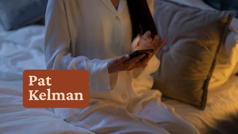 Woman scrolling phone in warm evening light — Instagram saves vs likes for coaches