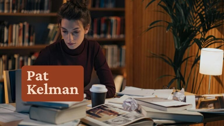 Woman researching on laptop in warm home office — niche research for coaches