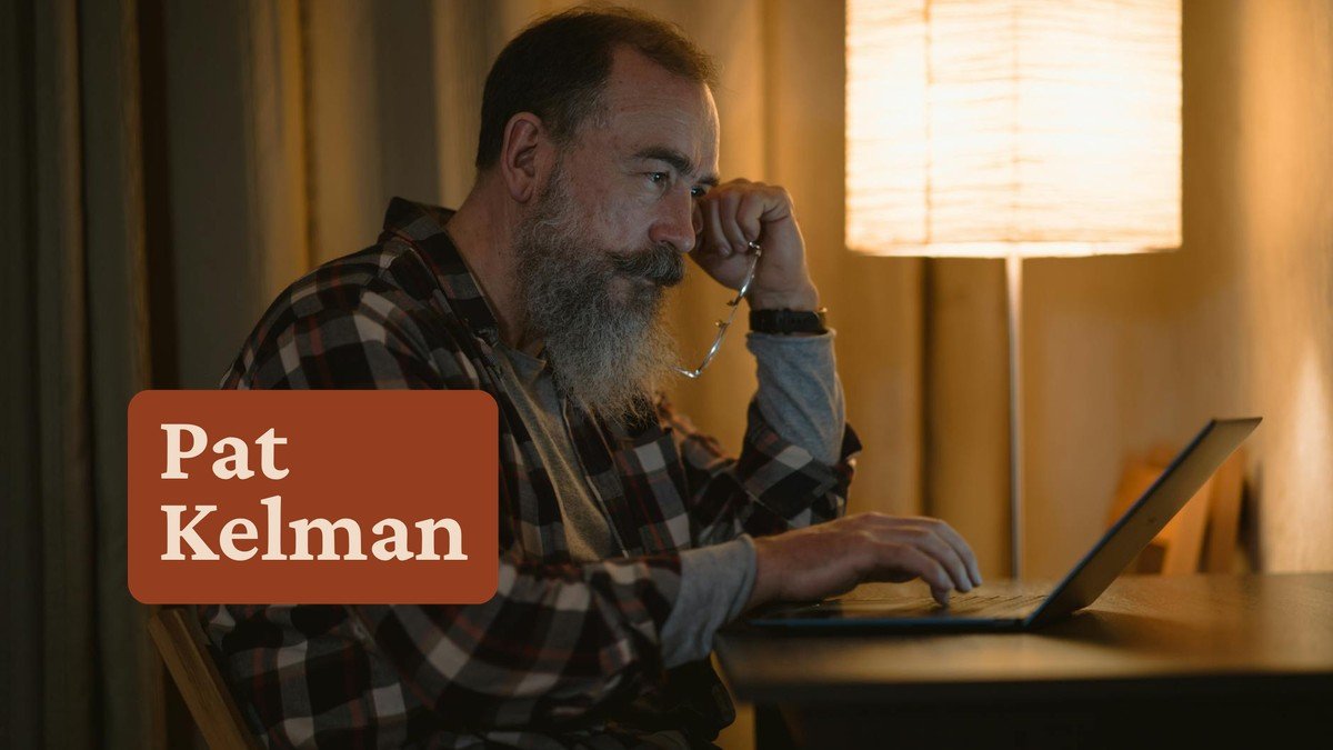 Person browsing laptop late at night in warm light — Reddit for coaches